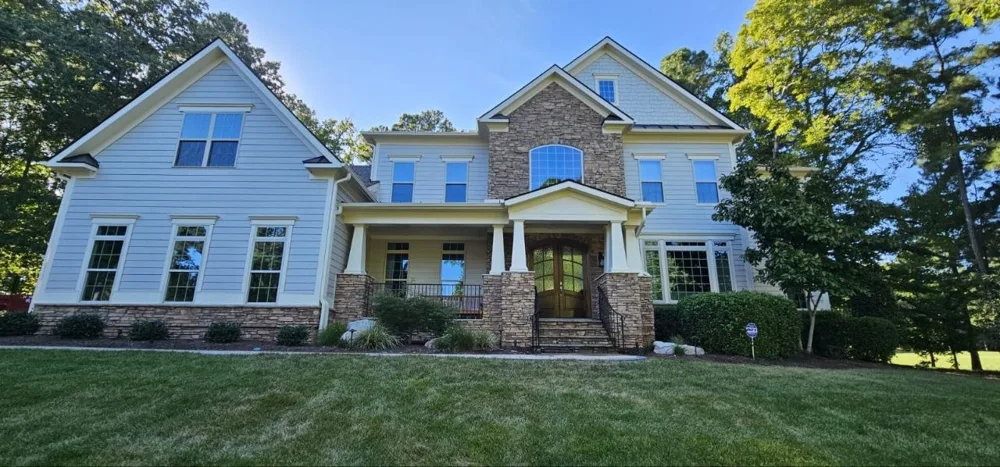 Painted house exterior with gables and front porch