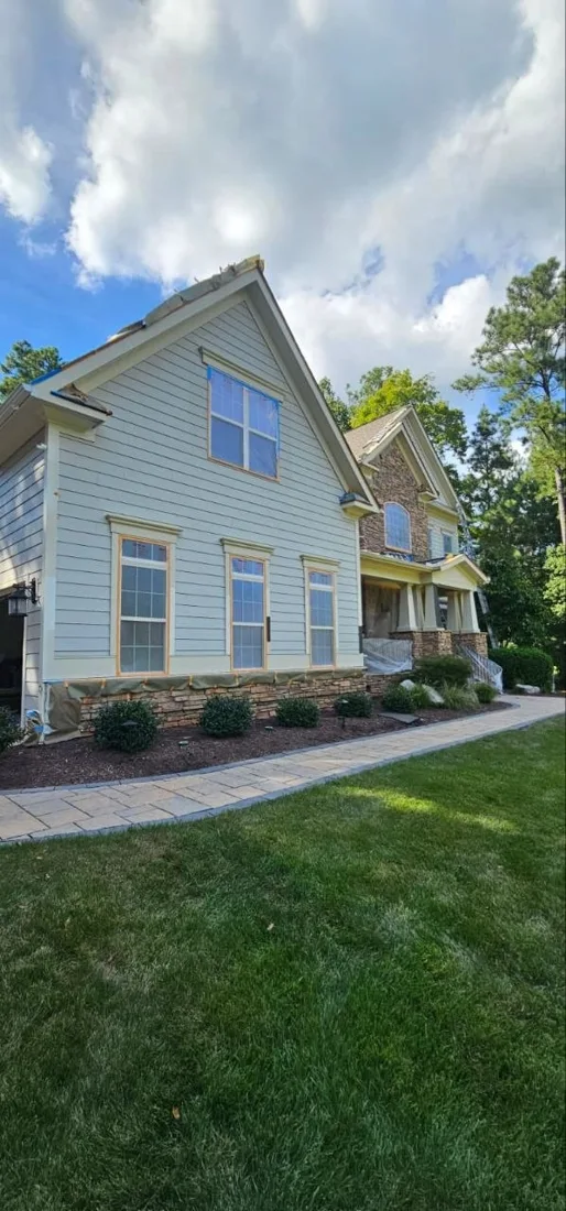 Painted house exterior and porch from the yard