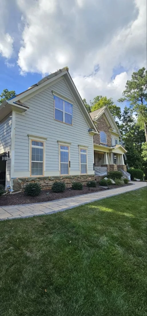Side exterior of a painted house with porch details