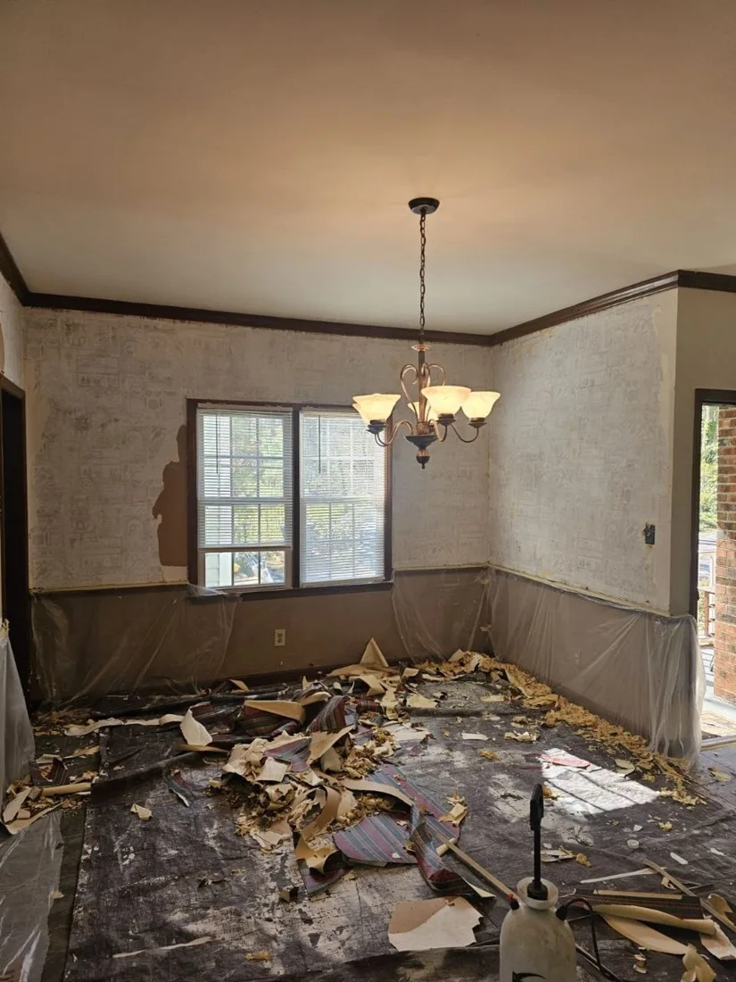Wallpaper removal work in an interior room