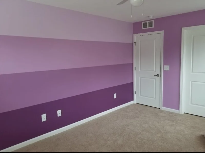 Bedroom with two-tone purple painted walls